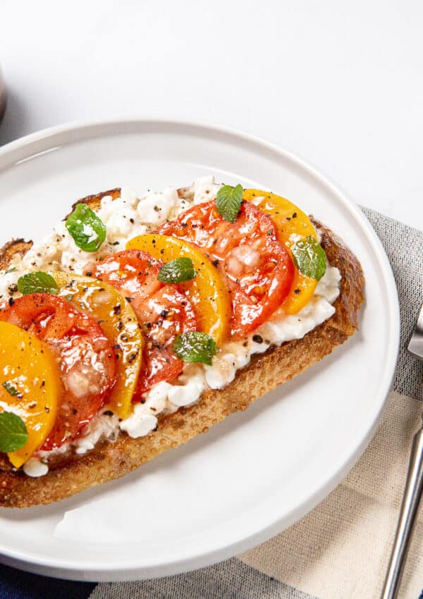 Cottage Cheese Toast with Peaches, Tomatoes, Mint & Blackberry Vinaigrette