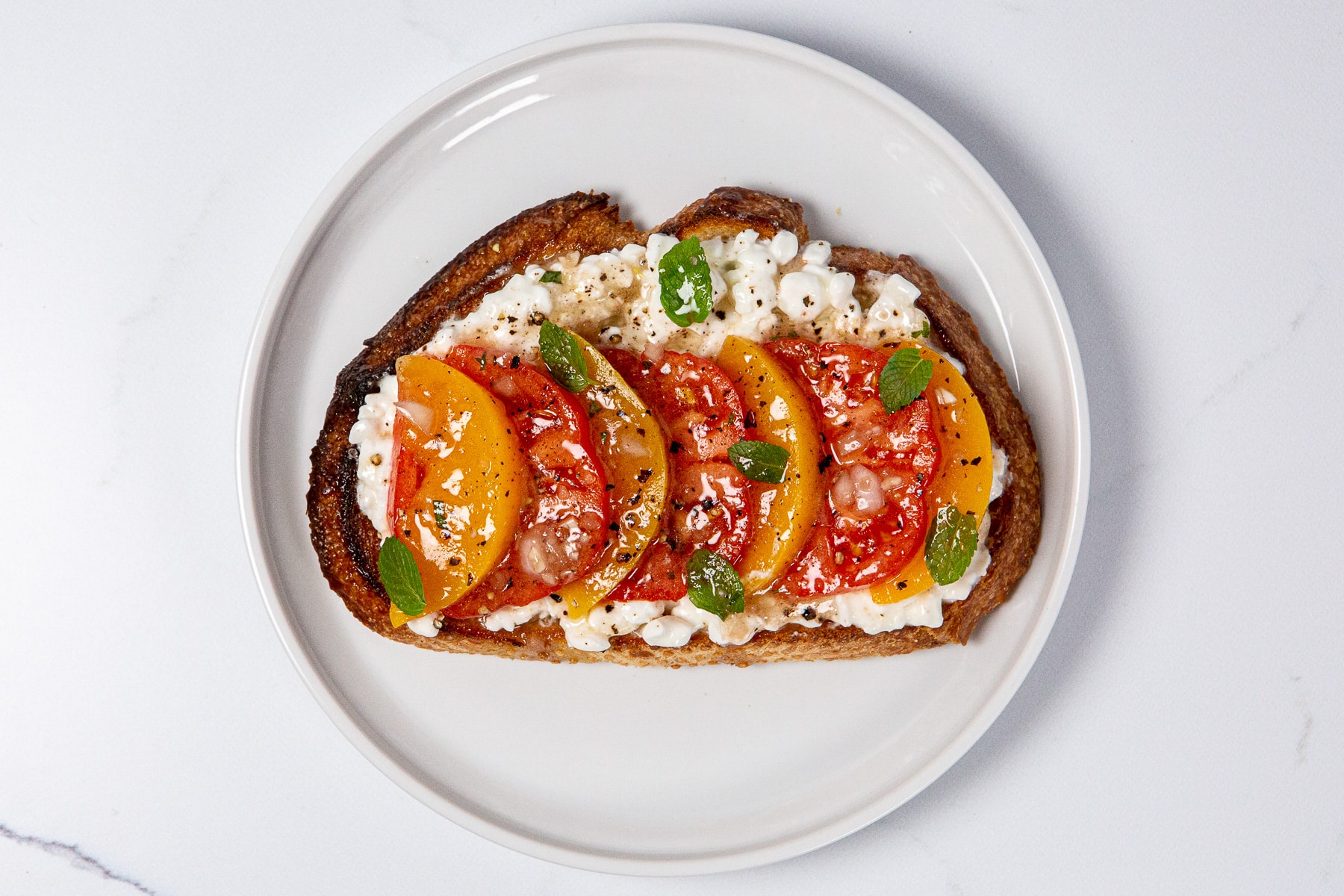 cottage cheese toast, southern caprese, cottage cheese toast with tomatoes peaches and mint