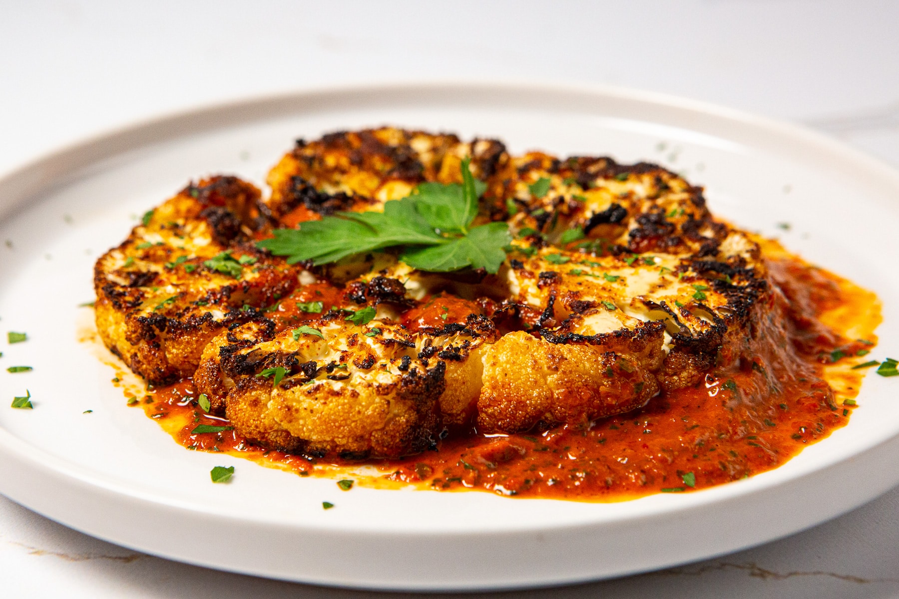 Air fryer cauliflower steaks, air fryer cauliflower, air fried cauliflower steaks, cauliflower steaks with red chimichurri sauce, cauliflower recipe, air fried cauliflower recipe, how to make cauliflower in the air fryer,