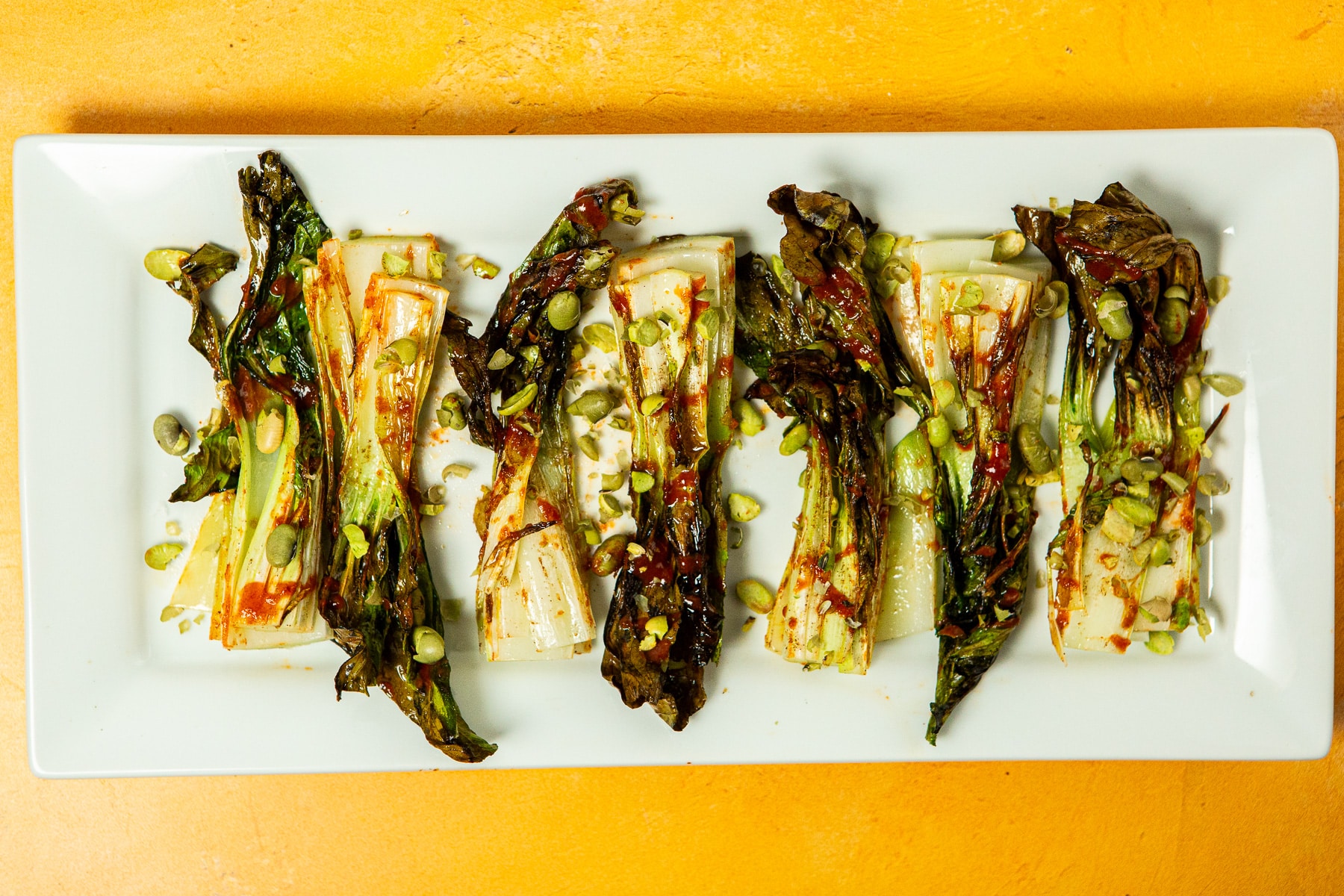 bok choy, air fryer bok choy, air fryer bok choy recipe, recipe for bok choy, how to cook bok choy in air fryer, baby bok choy air fryer, spicy bok choy recipe, EASY Air Fryer Bok Choy w/ Spicy Sriracha & Dry Roasted Edamame