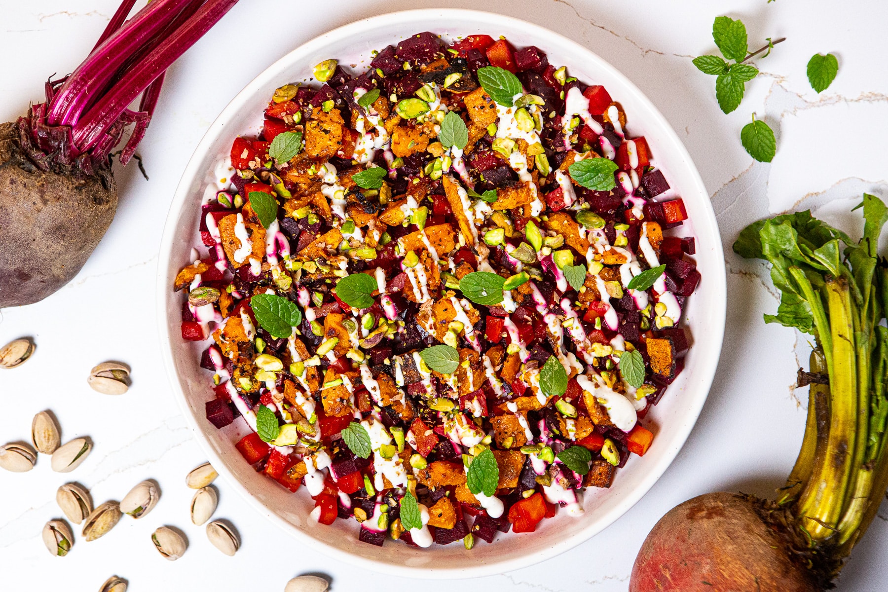 Beetroot and butternut squash salad, Butternut beetroot salad, beet salad, roasted beets, butternut squash and beet salad, beet salad recipe, horseradish sour cream sauce, how to make a beetroot and butternut squash salad, colorful salad, mint and pistachios, 