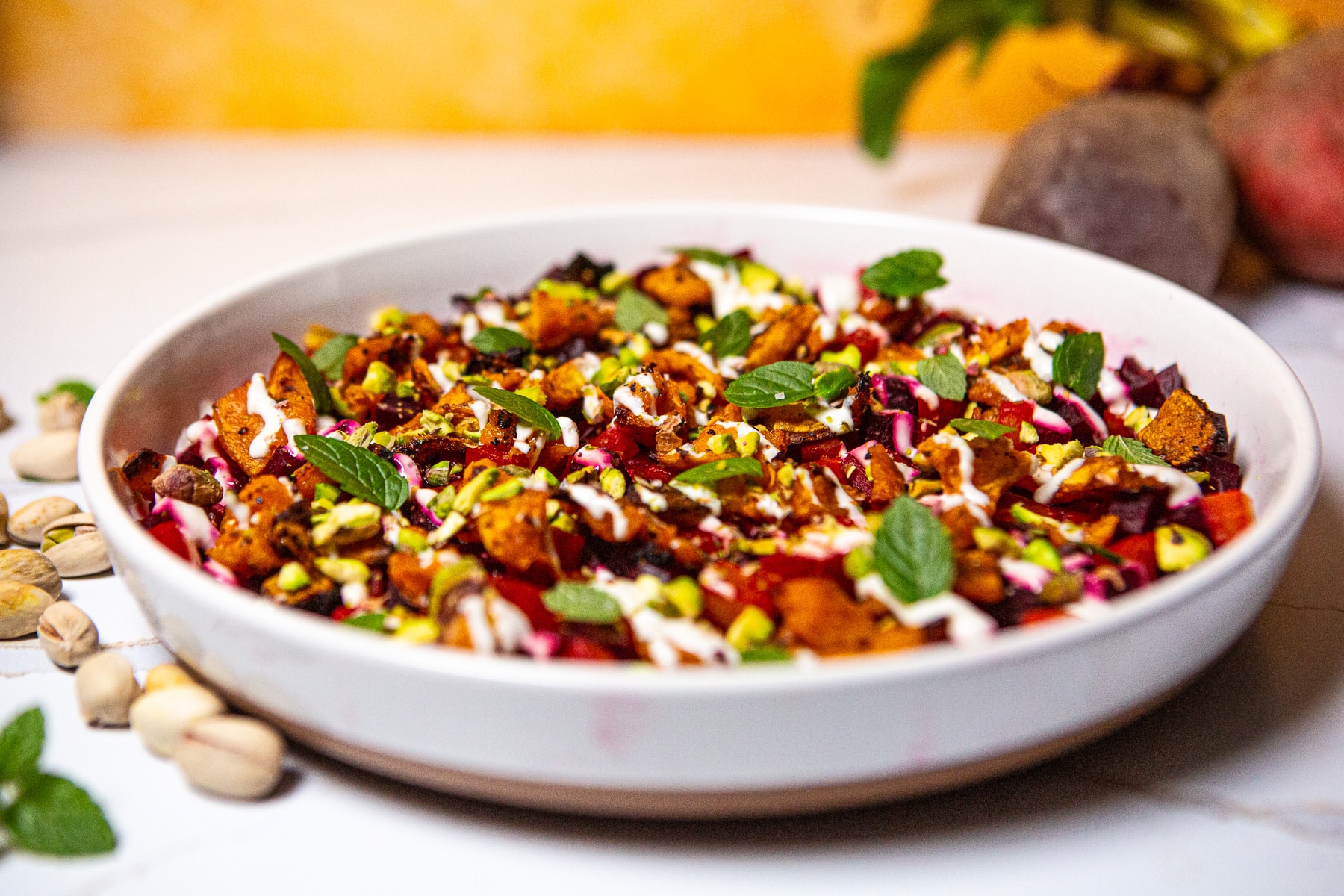Beetroot and butternut squash salad, Butternut beetroot salad, beet salad, roasted beets, butternut squash and beet salad, beet salad recipe, horseradish sour cream sauce, how to make a beetroot and butternut squash salad, colorful salad, mint and pistachios, 